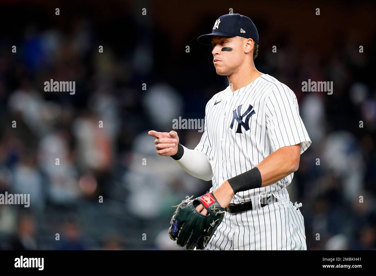 New York Yankees' Aaron Judge gestures to teammates after a baseball