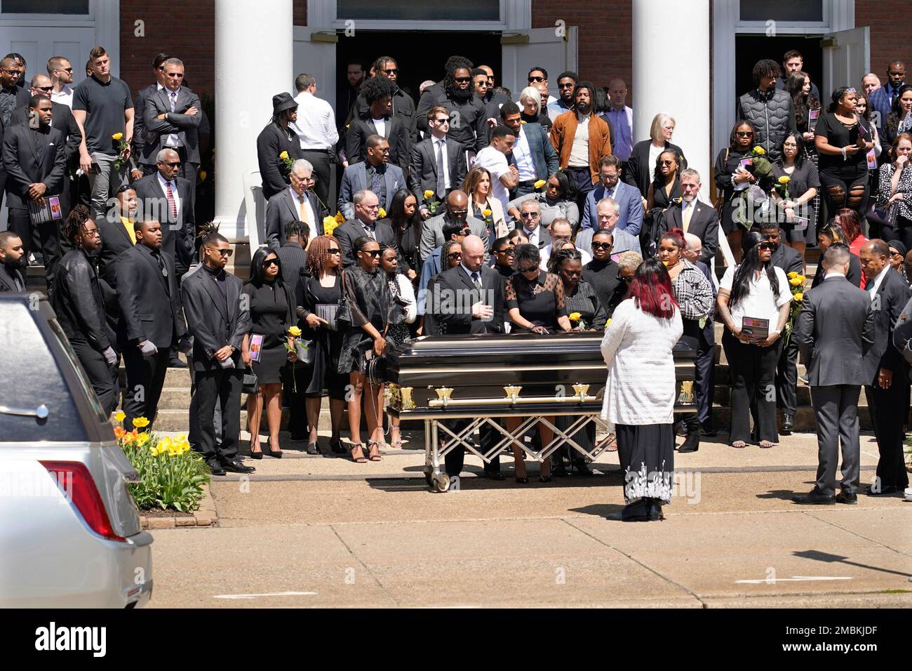 Friends and family console Kalabrya Haskins, center, behind casket(01)