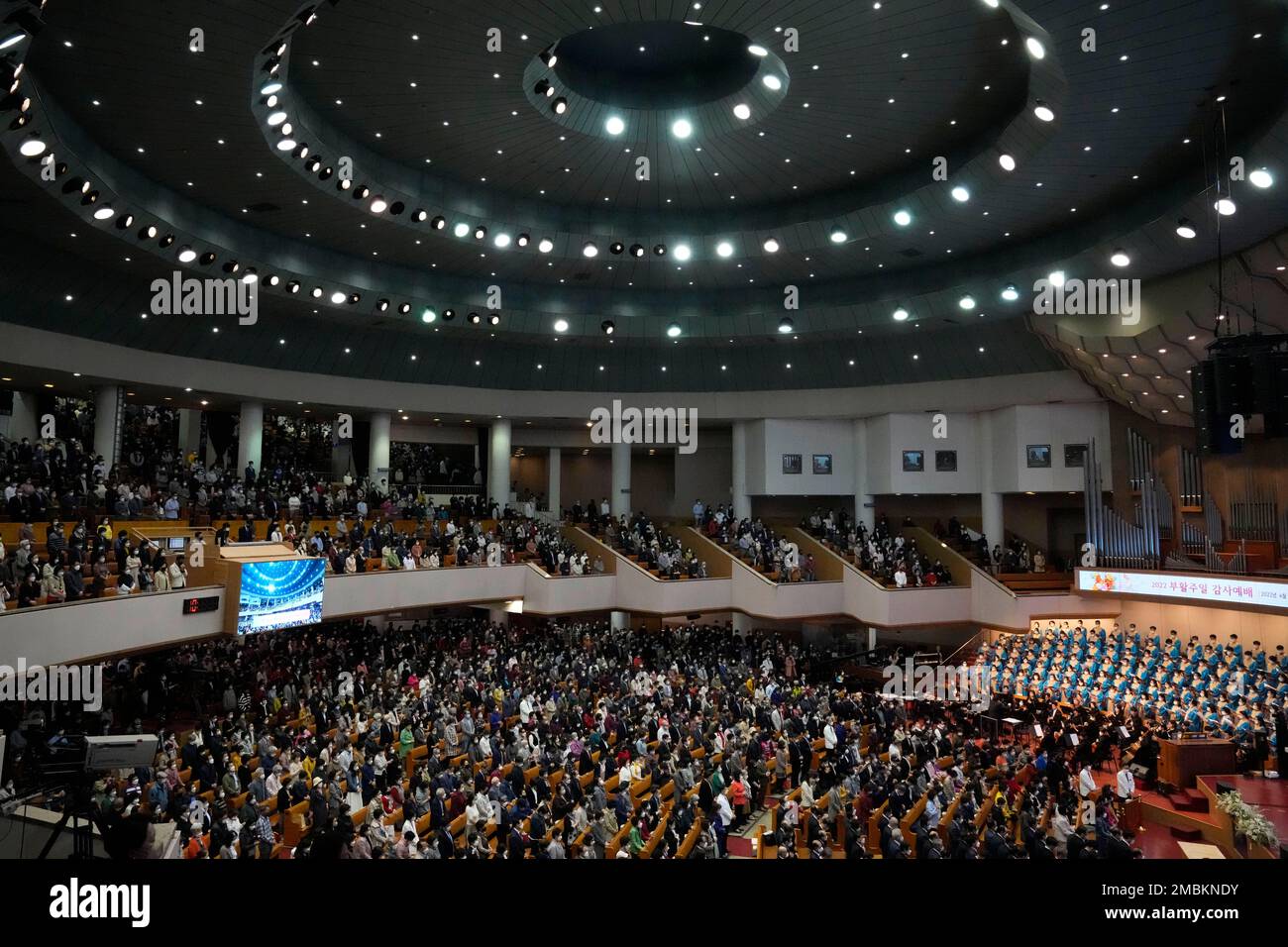 Christians wearing face masks attend an Easter service at the Yoido