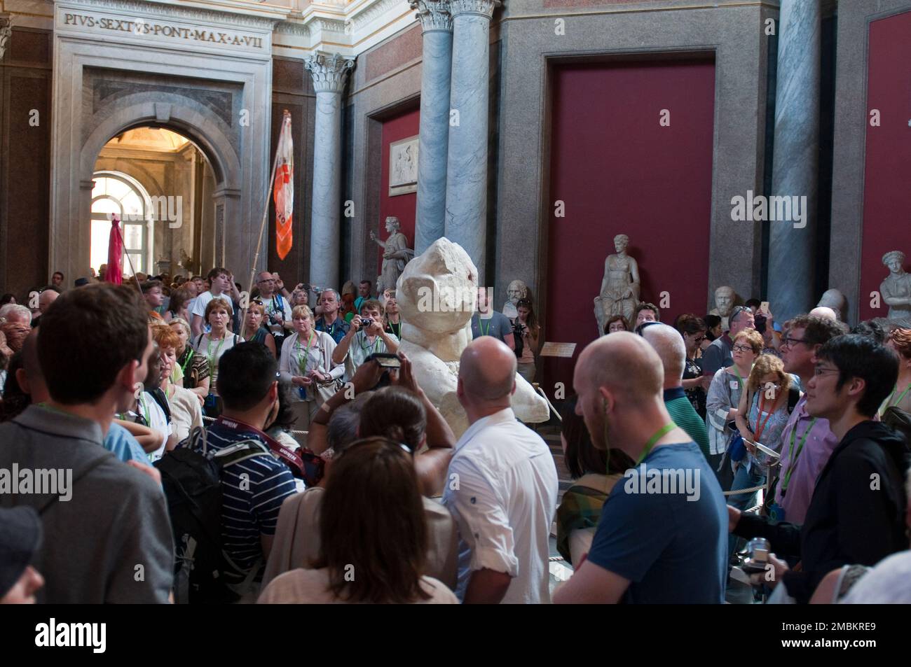 Visitors admire the artwork at the Vatican Museum Stock Photo Alamy