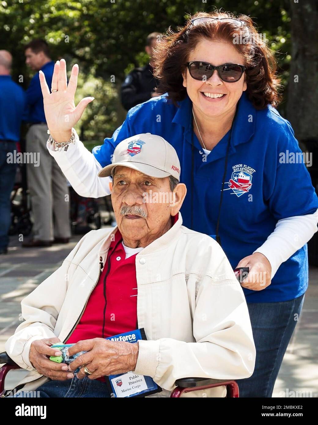 Jennifer Cross serving as a volunteer guardian for Pablo Ramirez, a Marine Corps veteran of the Korean War, on an Honor Flight trip to visit memorials in Washington, D.C.   Cross, the Naval Air Station Kingsville, Texas, administrative officer, is being recognized for her dedication to service members, past and present, as the sole recipient of the Navy’s 2021 Spirit of Hope Award.  The Spirit of Hope Awards are named in honor of entertainer Bob Hope, who entertained and supported troops from World War II through the first Gulf War. Each military service names one individual or organization an Stock Photo