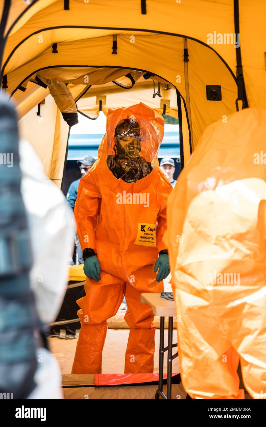 Staff Sgt. Jordan Cowart, Asst. Operations Non-Commissioned Officer, 10th Civil Support Team, awaits decontamination following entry into a training lane in Bellevue, Wash. on June 16, 2022. Stock Photo