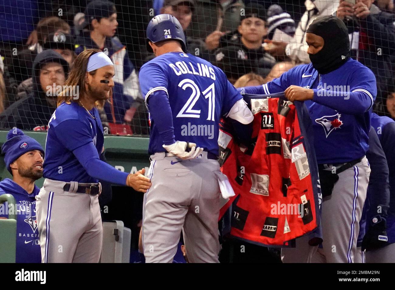 Toronto Blue Jays designated hitter Zack Collins (21) is congratulate