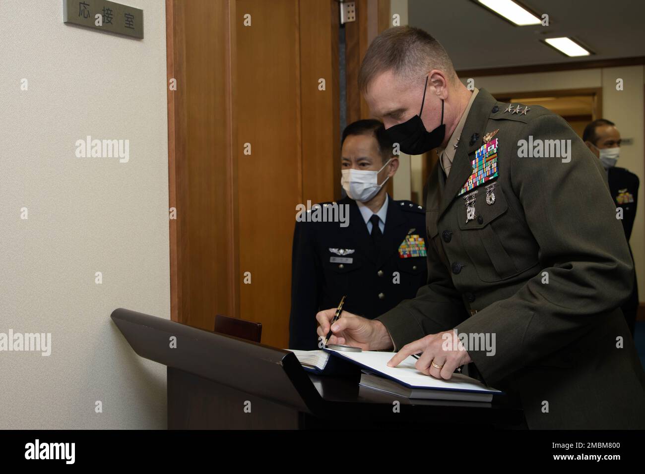 U.S. Marine Corps Lt. Gen. Steven R. Rudder, commander, U.S. Marine Corps Forces, Pacific, signs a distinguished visitors book after the Pacific Amphibious Leaders Symposium 2022, Tokyo, Japan, June 17, 2022. This iteration of PALS brought senior leaders of allied and partnered militaries together to discuss amphibious force readiness, expeditionary advanced base operations, intermediate force capabilities, and ways to improve interoperability between partners within the Indo-Pacific region. A total of 18 participating delegations from Asia, Australia, Europe, South America, and North America Stock Photo