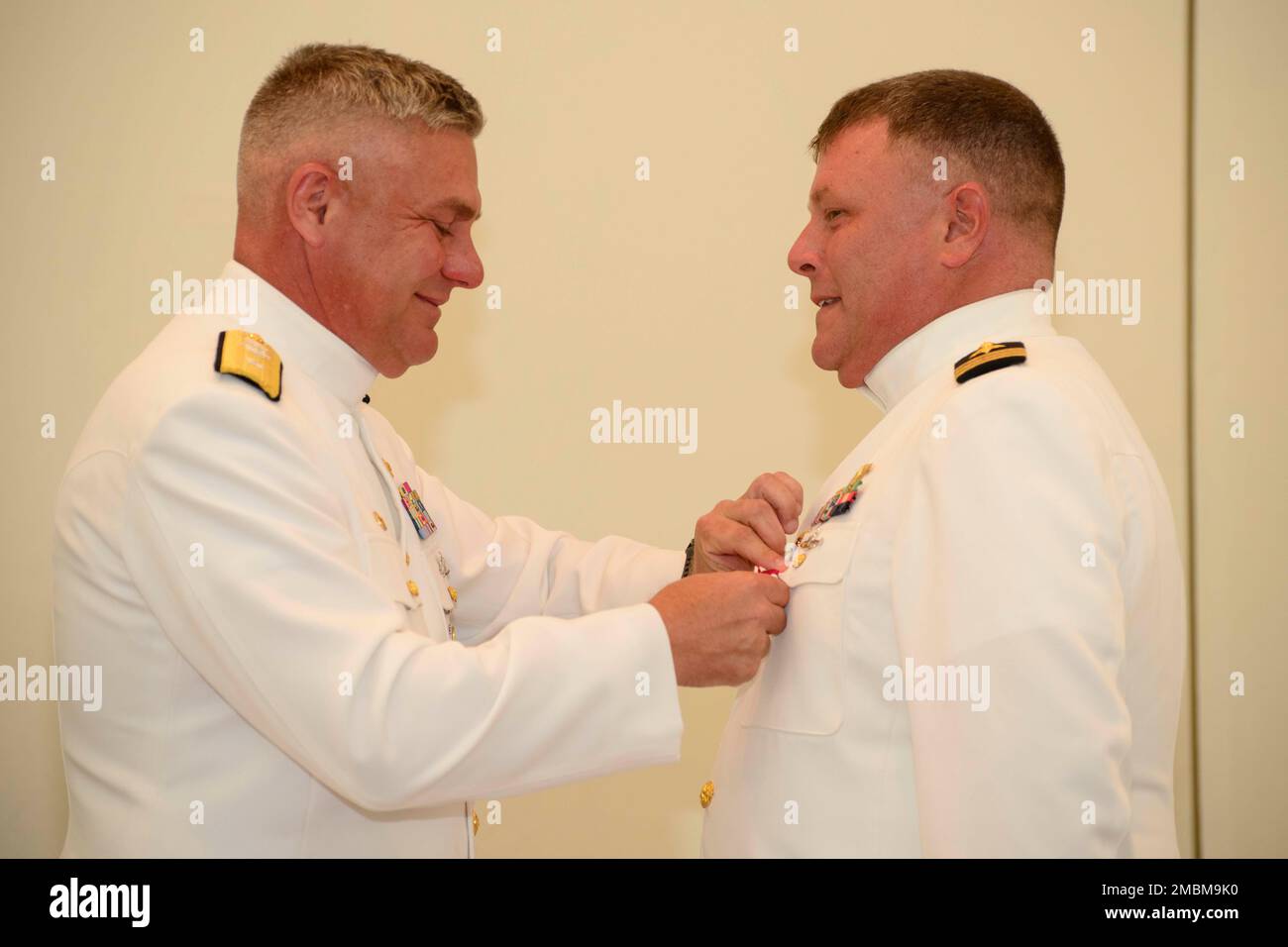 KINGS BAY, Ga. (Jun. 17, 2022) Rear Adm. John Spencer, Commander, Submarine Group 10, presents Cmdr. Ron Allen, outgoing commanding officer of Submarine Readiness Squadron 36, with the Meritorious Service Medal during a change of command ceremony held at the chapel onboard Naval Submarine Base Kings Bay, Allen is relieved by Cmdr. Samuel Scovill as the squadron’s commanding officer. U.S. Navy photo by Chief Mass Communication Specialist Ashley Berumen (Released) Stock Photo