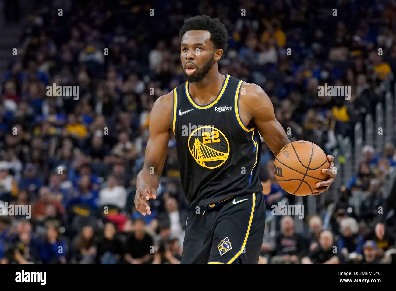 Golden State Warriors forward Andrew Wiggins brings the ball up against