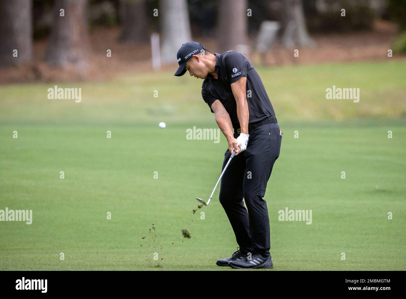 Collin Morikawa hits on from the second fairway during the third round
