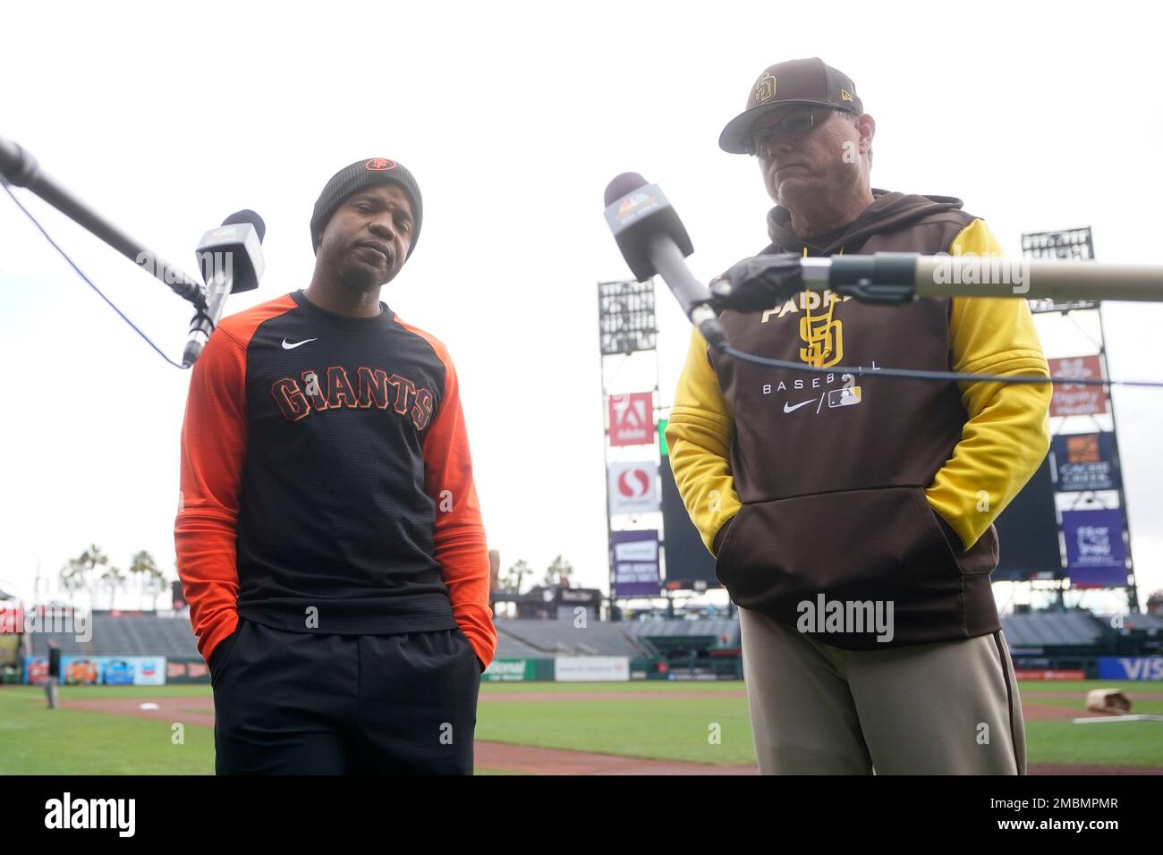 San Francisco Giants first base coach Antoan Richardson, left, speaks