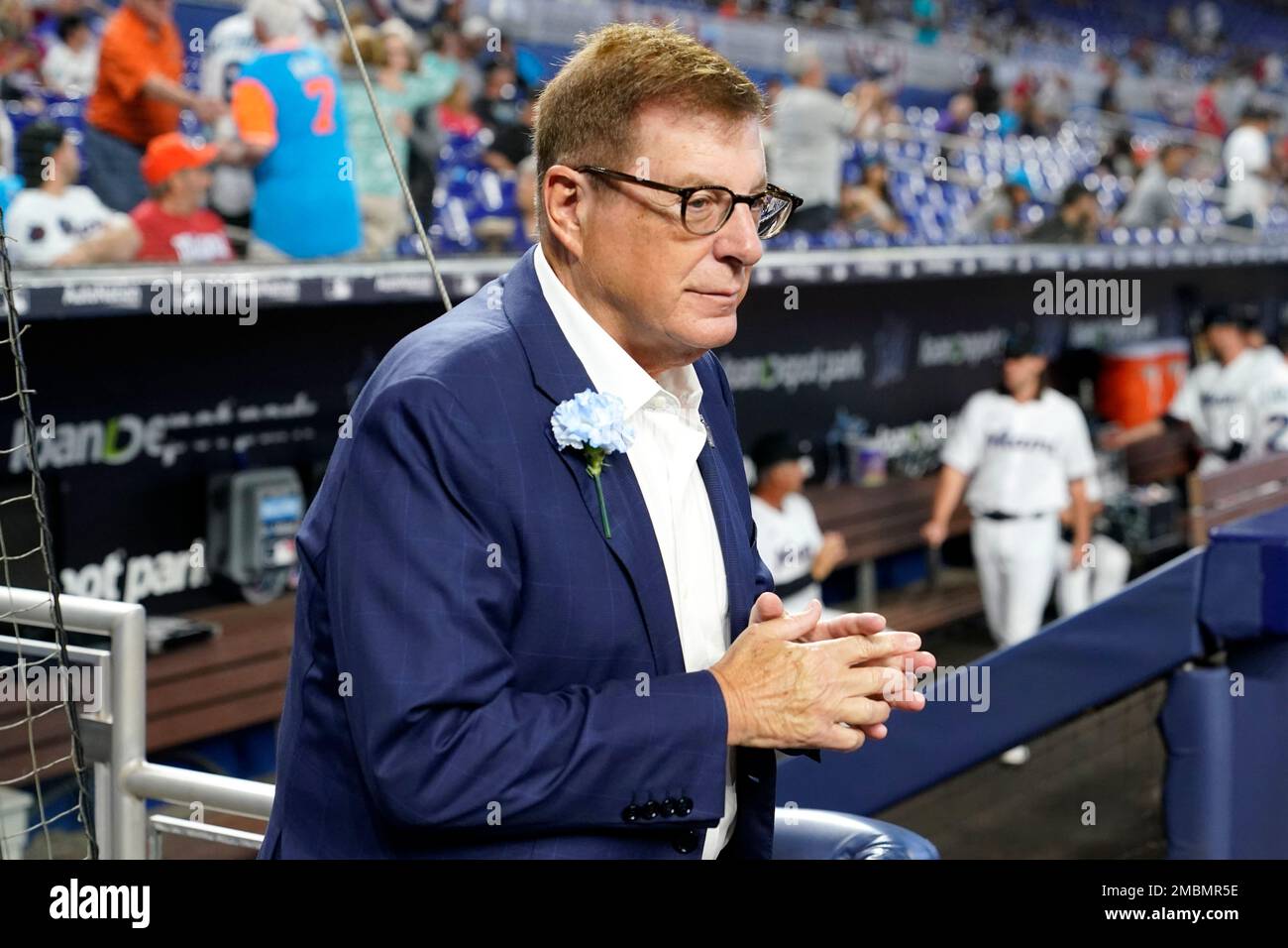 Former Miami Marlins player Jeff Conine waves to fans as he arrives for a  Miami Marlins baseball FanFest event, Saturday, Feb. 11, 2023, in Miami.  Conine is now a special assistant to