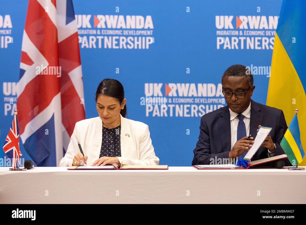 Britain's Home Secretary Priti Patel, left, and Rwanda's Minister of