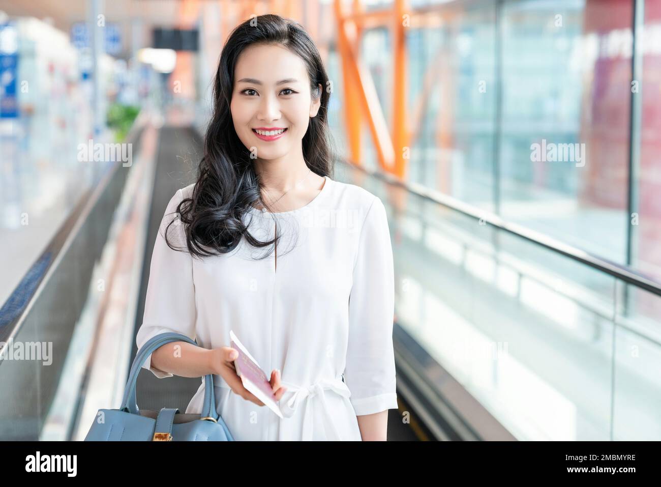 The young woman at the airport Stock Photo - Alamy