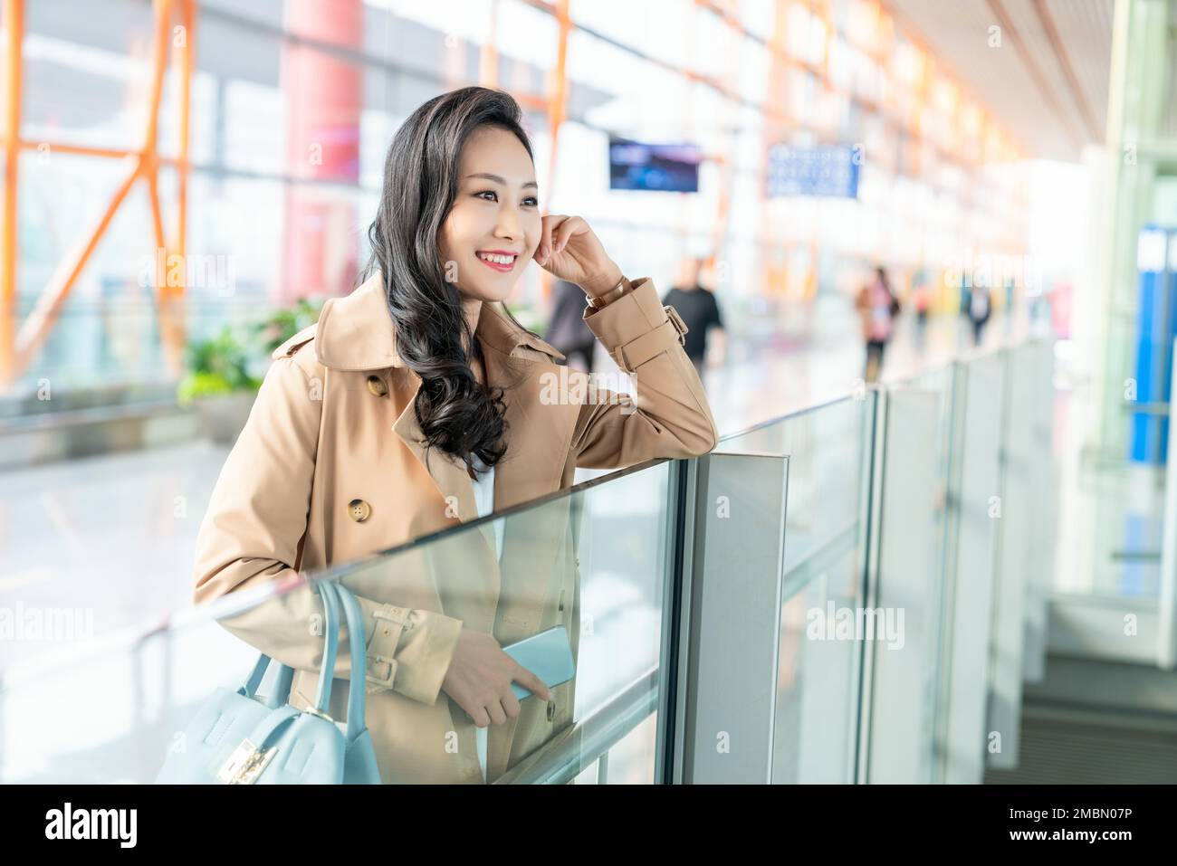 The young woman at the airport Stock Photo - Alamy