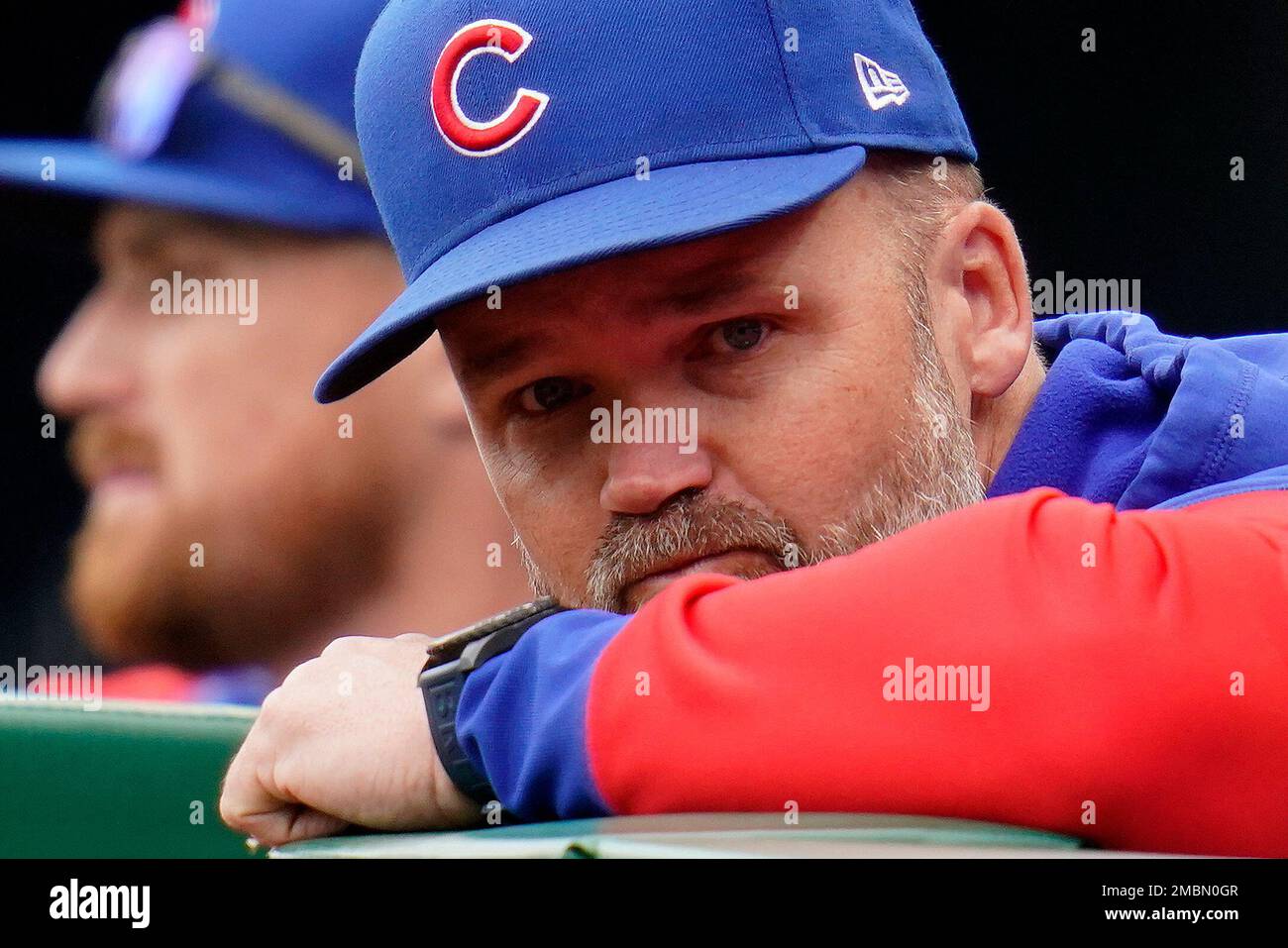 Chicago Cubs manager David Ross stands on the dugout steps during the
