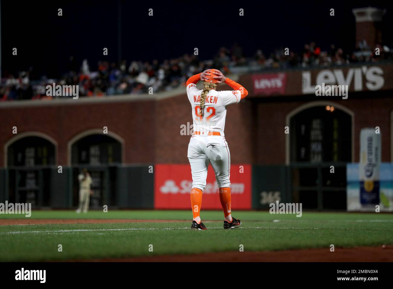 San Francisco Giants first base coach Alyssa Nakken walks to get in