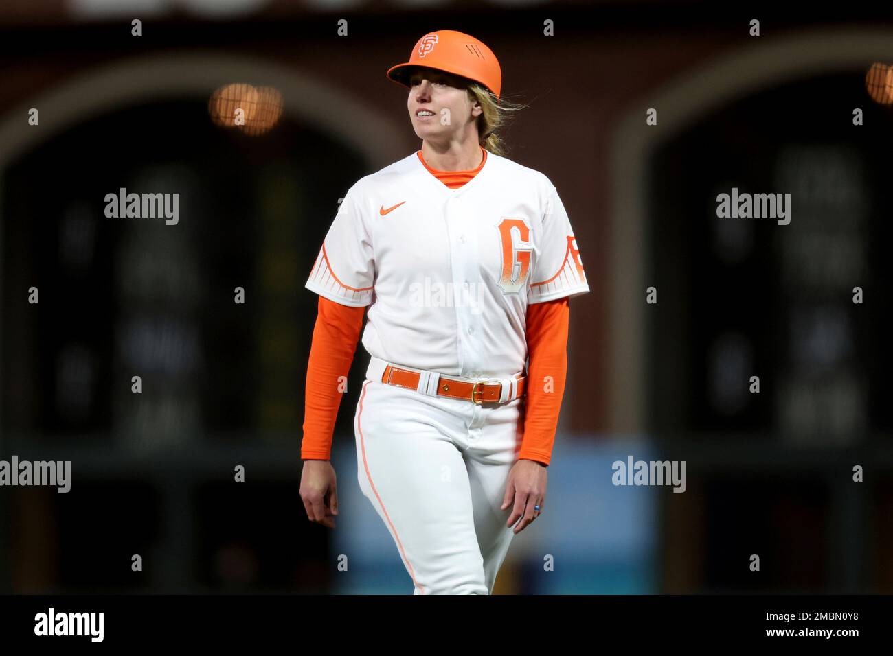 San Francisco Giants first base coach Alyssa Nakken stands on the field
