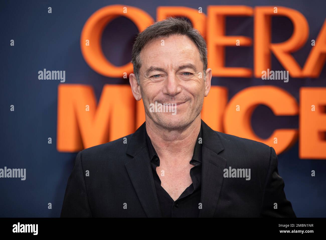 Jason Isaacs poses for photographers upon arrival at the premiere of