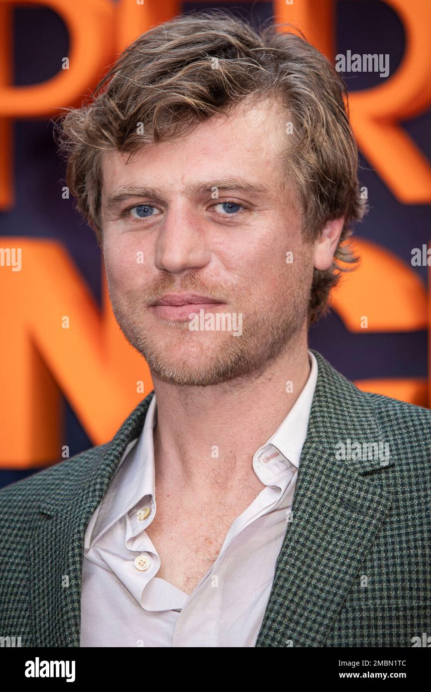 Johnny Flynn poses for photographers upon arrival at the premiere of