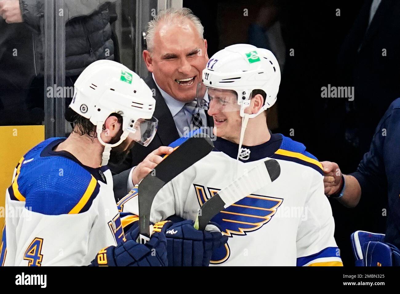 Former St. Louis Blues defenseman Al MacInnis and his family watch as his  number 2 is hoisted to the rafters during a pre-game ceremony at the Savvis  Center in St. Louis on April 9, 2006. MacInnis retired in September after  playing ten seasons with St