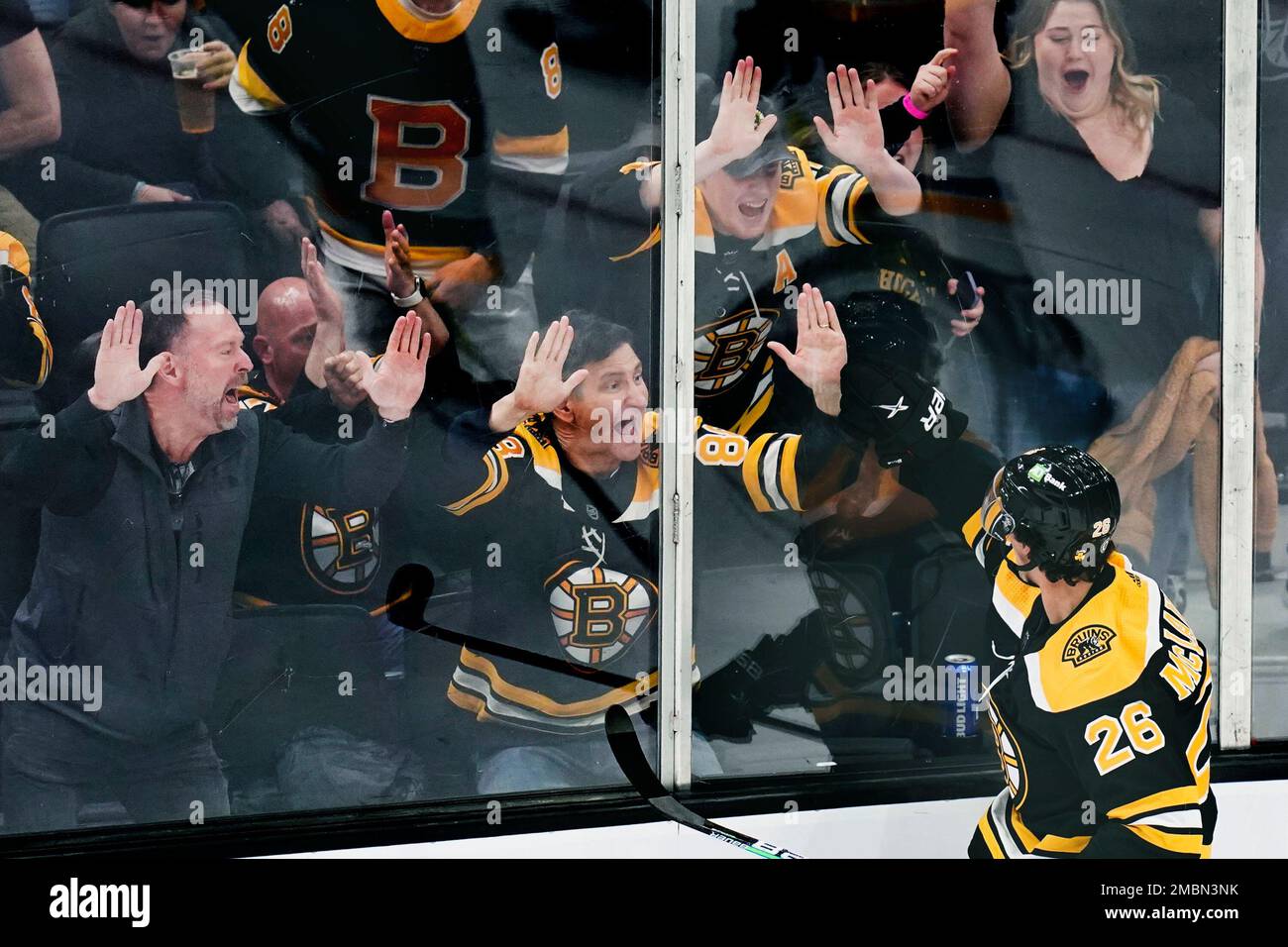 Boston Bruins center Marc McLaughlin (26) celebrates with fans after ...