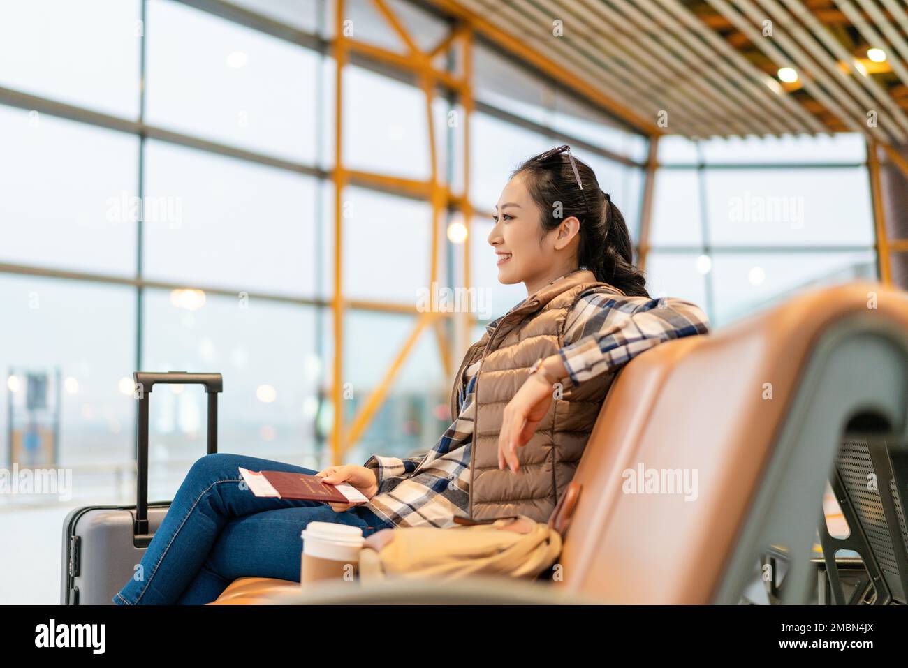 A young woman in the airport lounge Stock Photo - Alamy