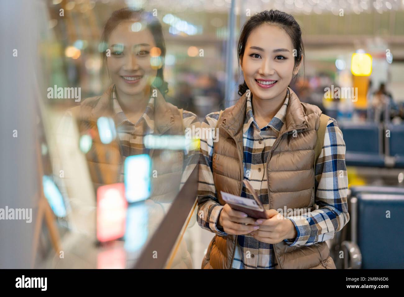 A young woman in the airport lounge Stock Photo - Alamy