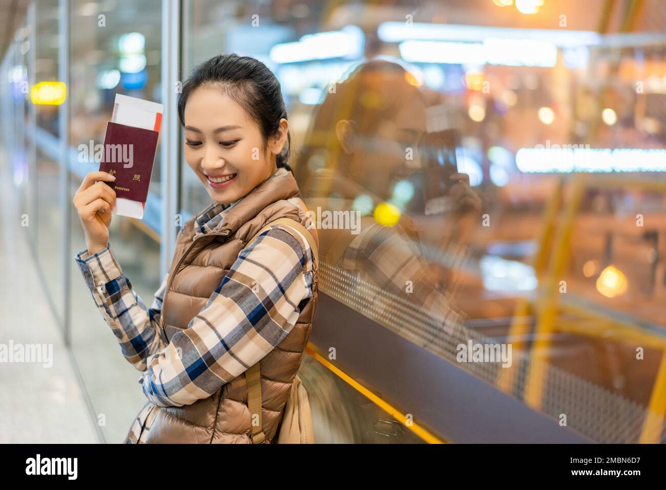 A young woman in the airport lounge Stock Photo - Alamy