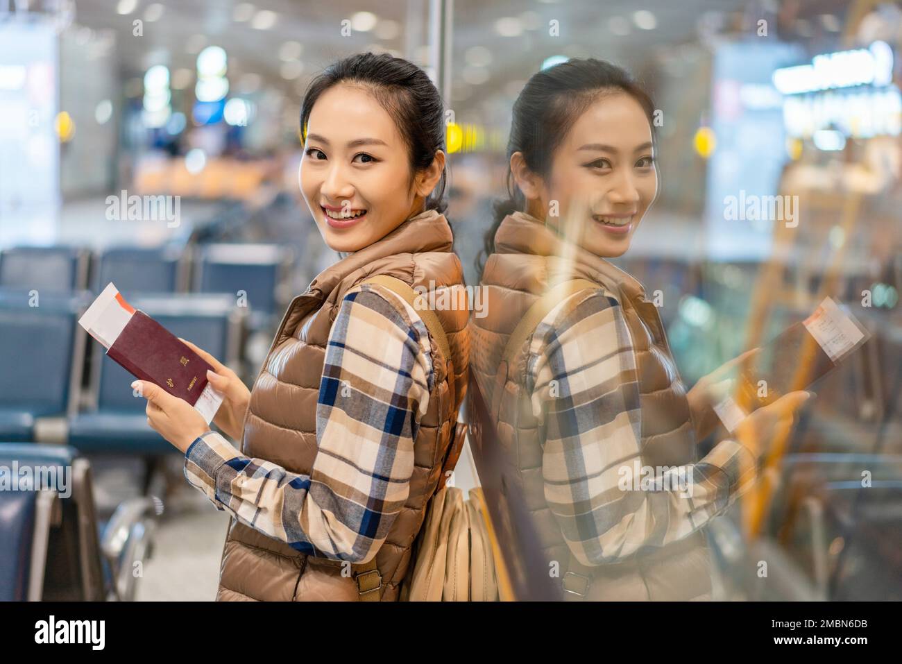 A young woman in the airport lounge Stock Photo - Alamy
