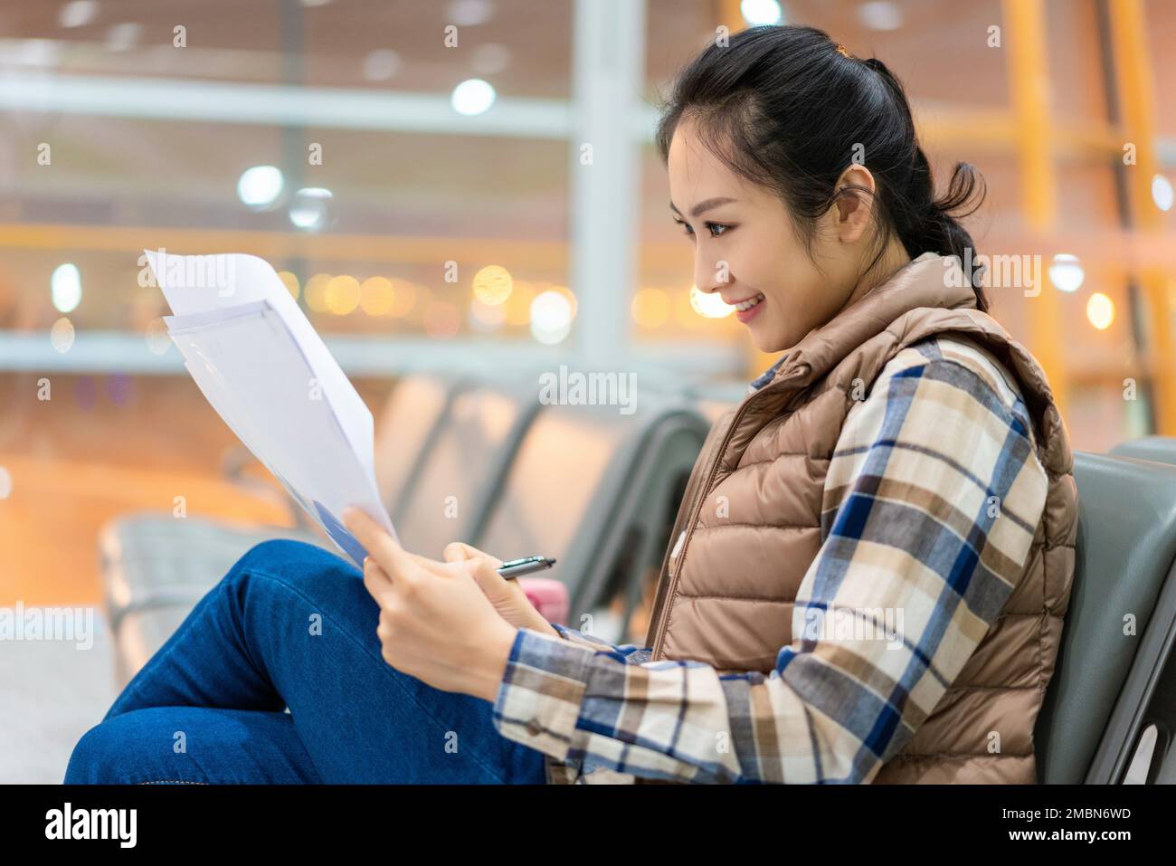 The young woman at the airport Stock Photo - Alamy