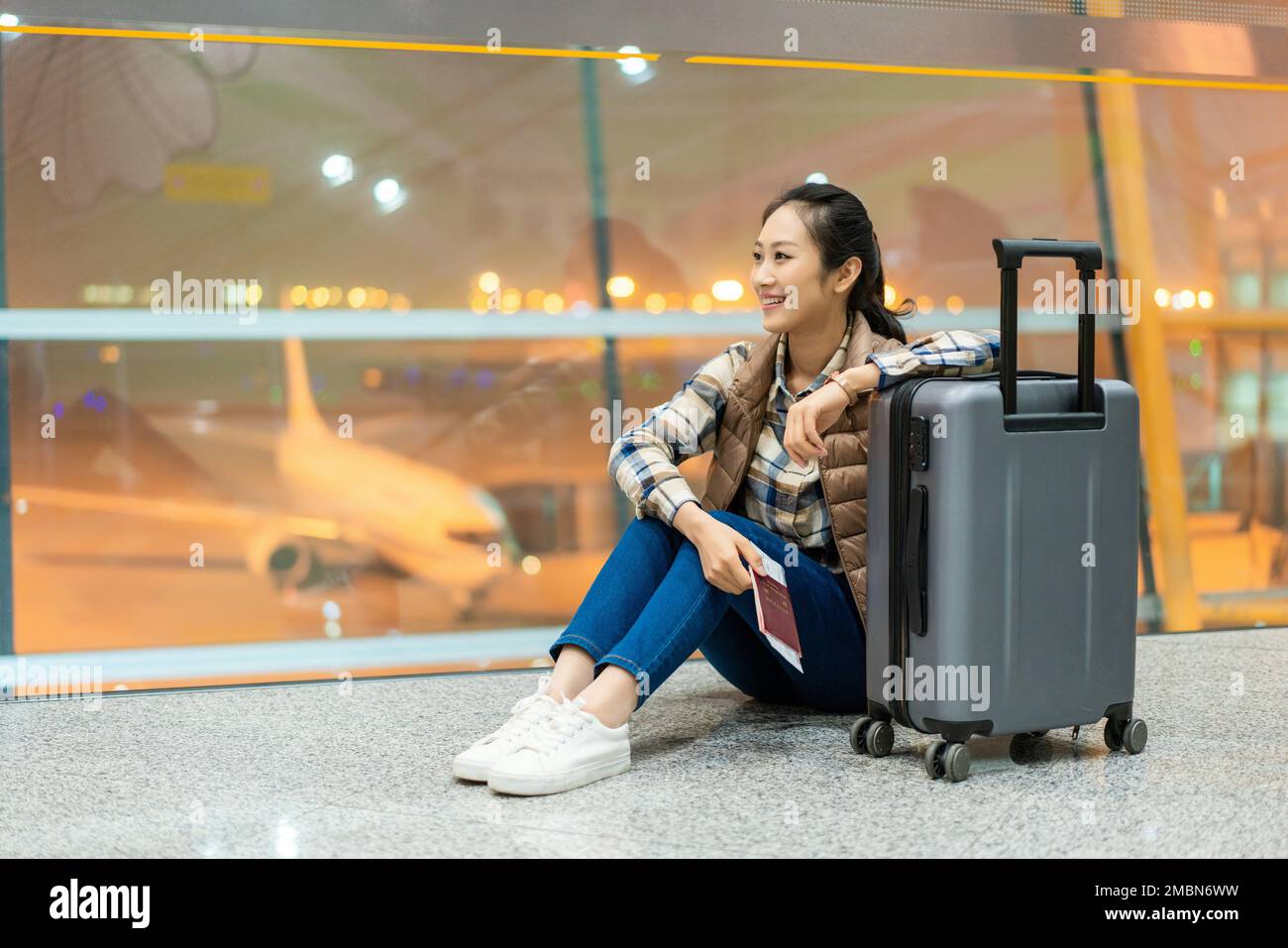 The young woman at the airport Stock Photo - Alamy