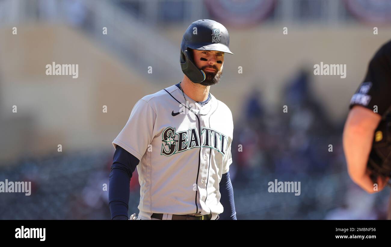 Seattle Mariners right fielder Mitch Haniger (17) walk off the field after striking out during