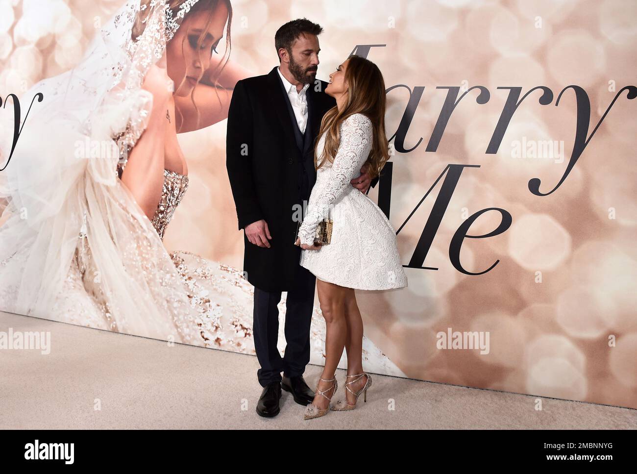 FILE - Cast member Jennifer Lopez, right, and Ben Affleck attend a photo  call for a special screening of "Marry Me" at DGA Theater on Tuesday, Feb.  8, 2022, in Los Angeles.