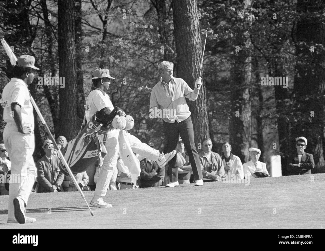 FILE Jack Nicklaus throws up his putter as his caddie, Willie
