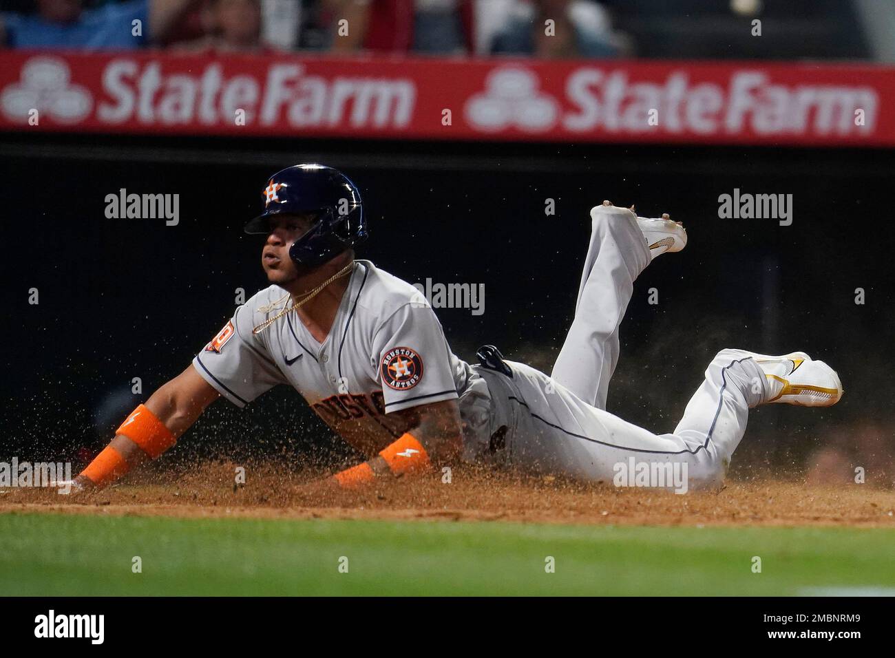 Houston Astros' Jose Siri scores from third base after a ground ball from  Jose Altuve during the fifth inning of the team's baseball game against the  Los Angeles Angels on Friday, April