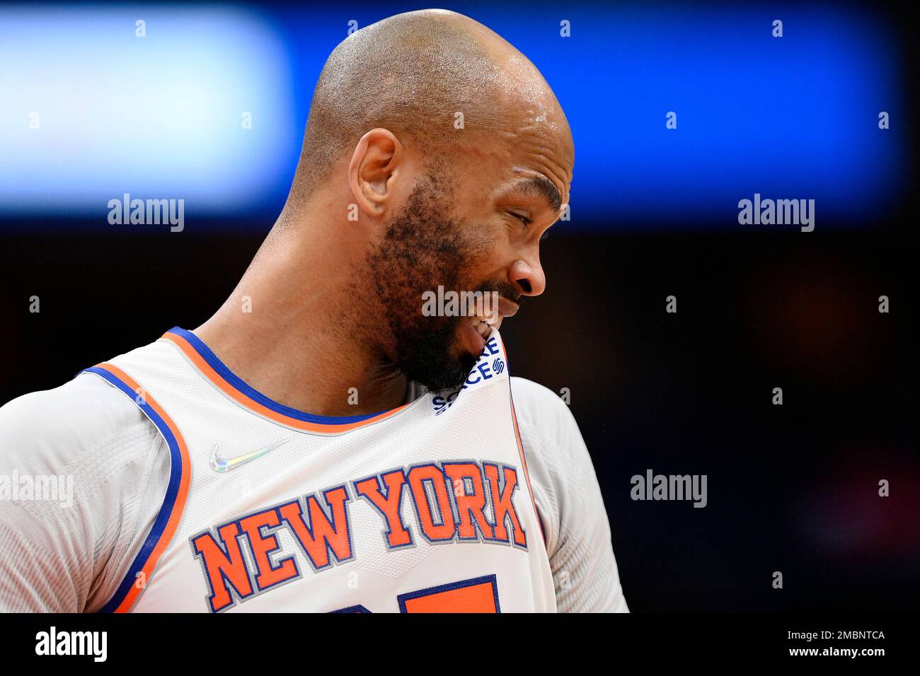 New York Knicks center Taj Gibson bites his jersey during the first half of the teams NBA basketball game against the Washington Wizards, Friday, April 8, 2022, in Washington