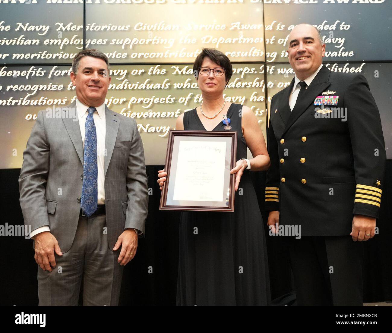 Robin Ross receives the Navy Meritorious Civilian Service Award at the