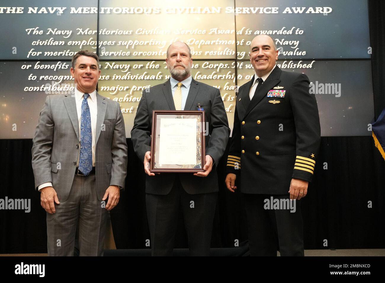 John Jims receives the Navy Meritorious Civilian Service Award at the