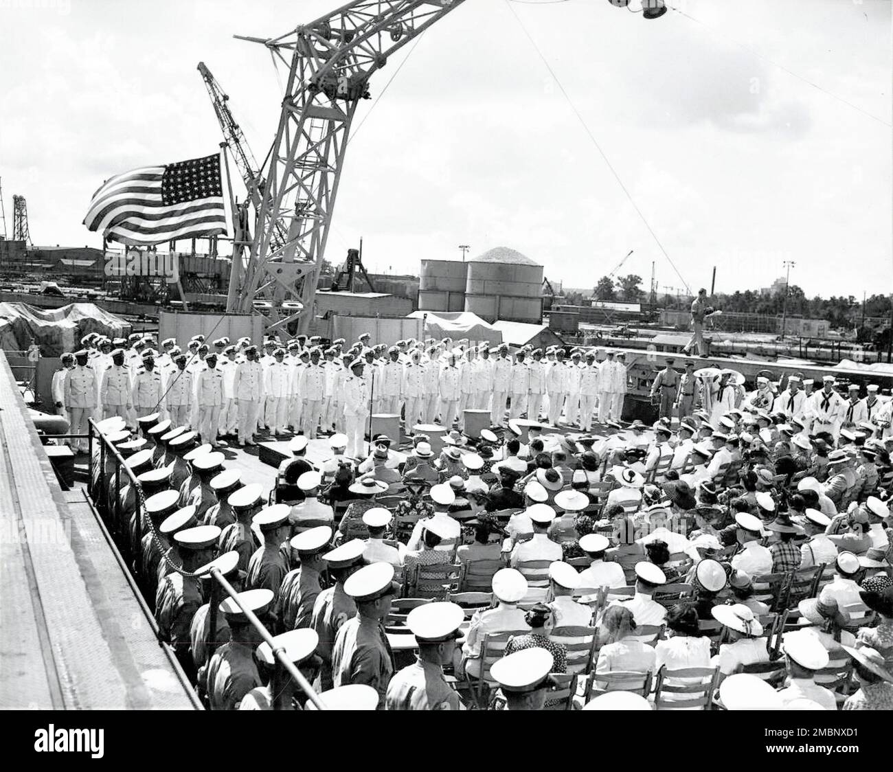 The USS Alabama's (BB-60) commissioning ceremony was held Aug. 16, 1942. Capt. George Wilson, Commanding Officer for the Alabama, provided the address and many were in attendance. Stock Photo