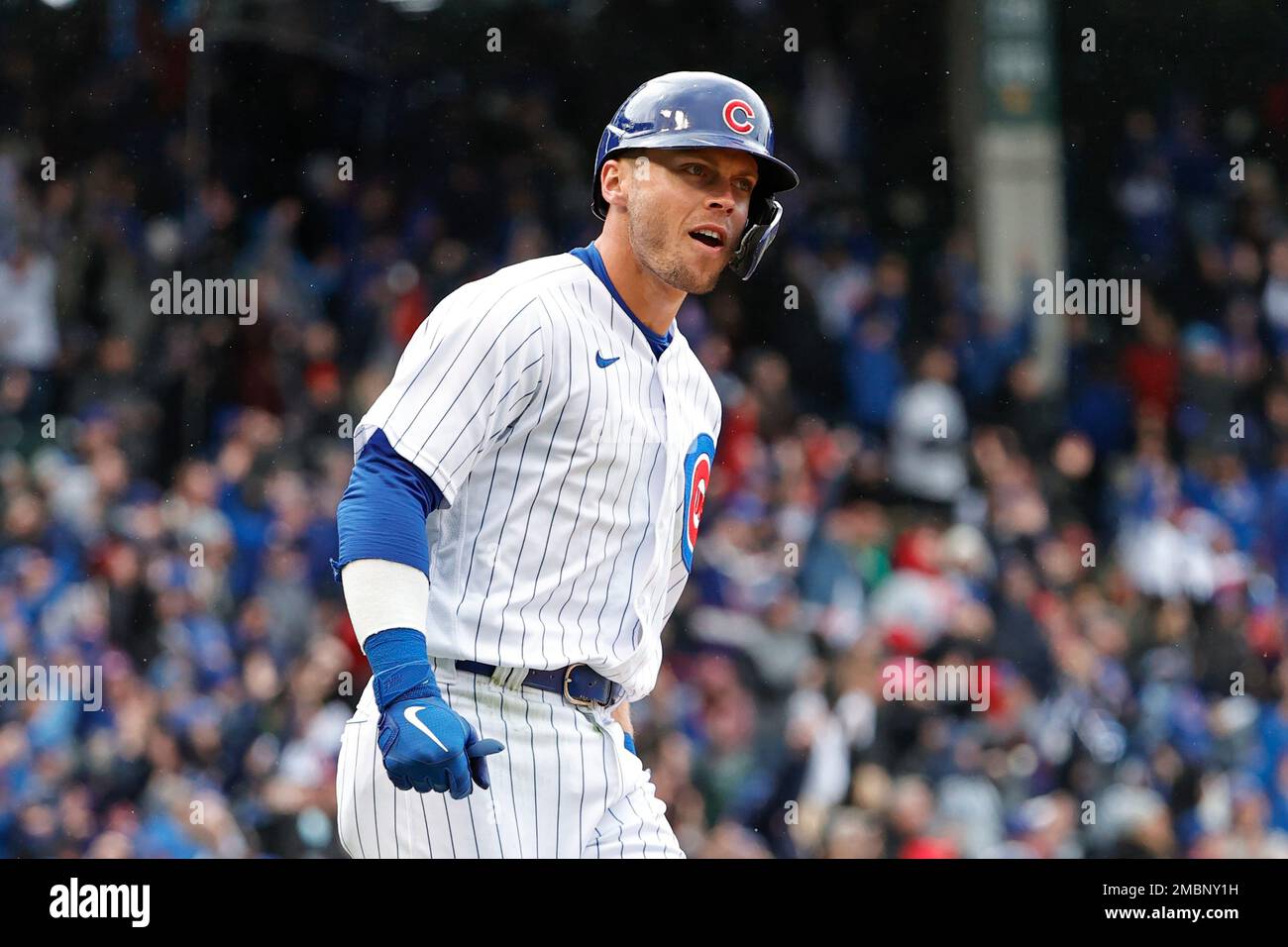 Chicago Cubs' Nico Hoerner rounds the bases after hitting a tworun