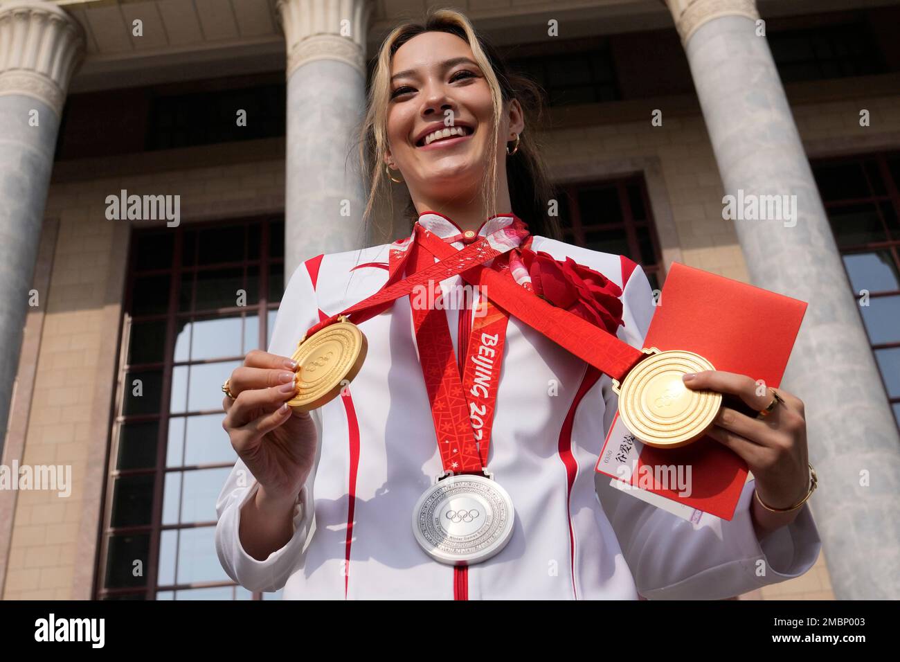 Olympic gold medalist Eileen Gu poses with her three medals before a ...