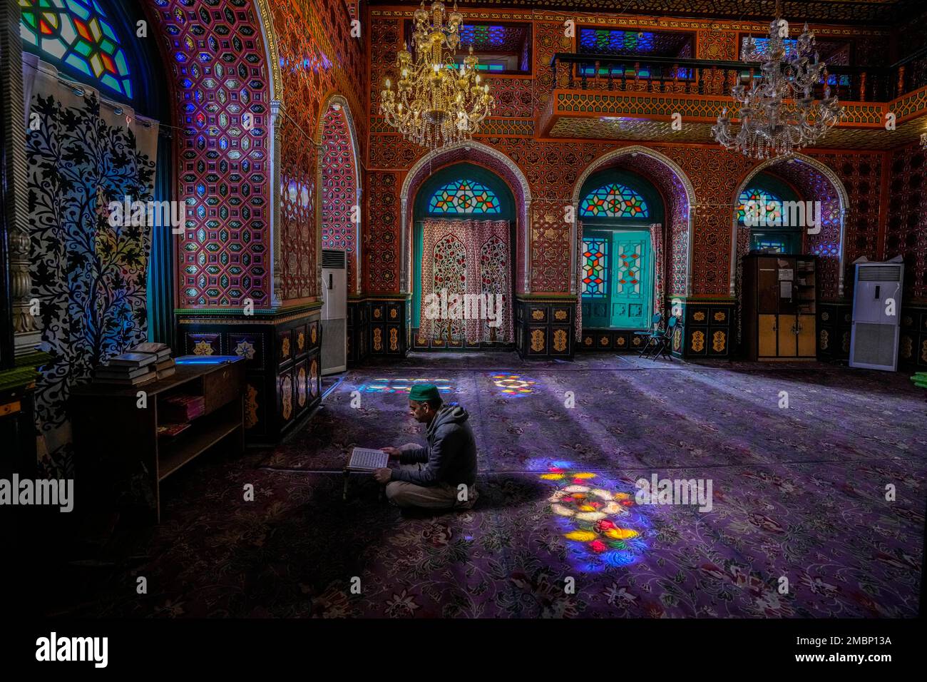 A Kashmiri man reads verses from holy Quran inside the shrine of Sufi ...