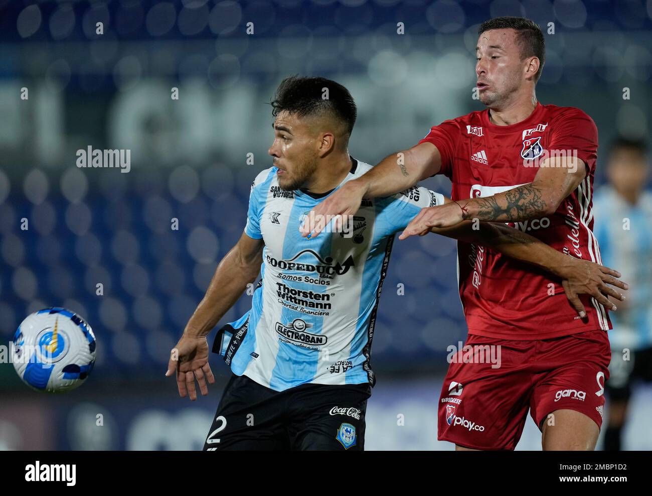 Aquilino Gimenez of Paraguay's Guairena FC, left, and Luciano Pons