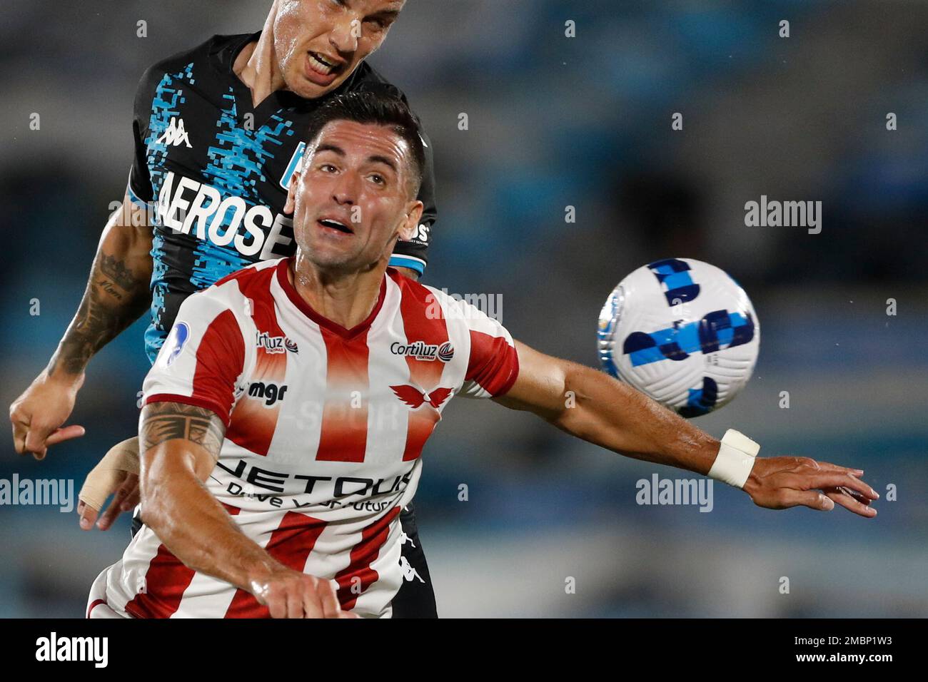 Enzo Copetti of Argentina's Racing Club, back, and Horacio