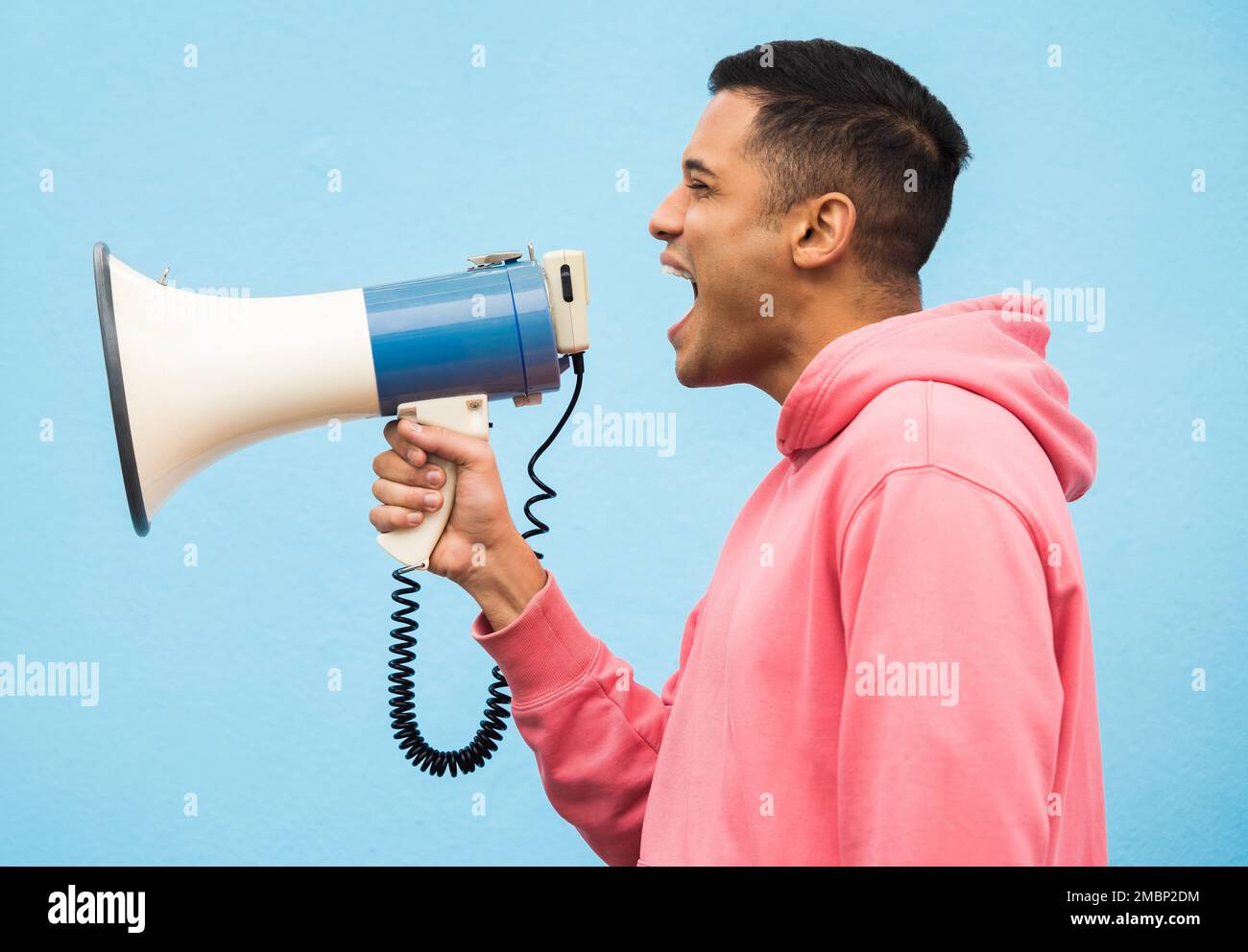 Man, speaker and megaphone in studio for justice, microphone speech and