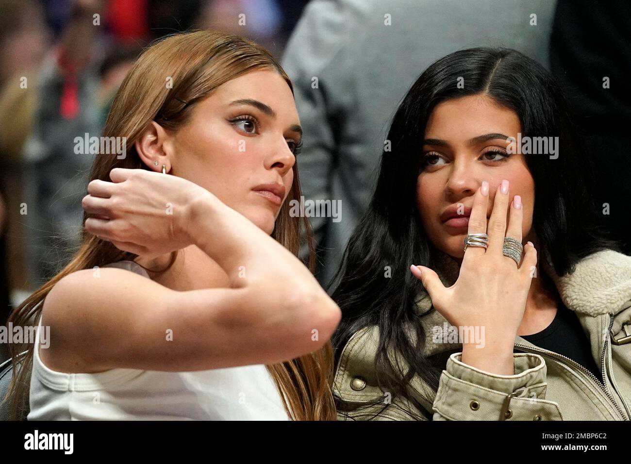 Kendall, left, and Kylie Jenner watch during the second half of an NBA  basketball game between the Los Angeles Clippers and the Phoenix Suns  Wednesday, April 6, 2022, in Los Angeles. (AP
