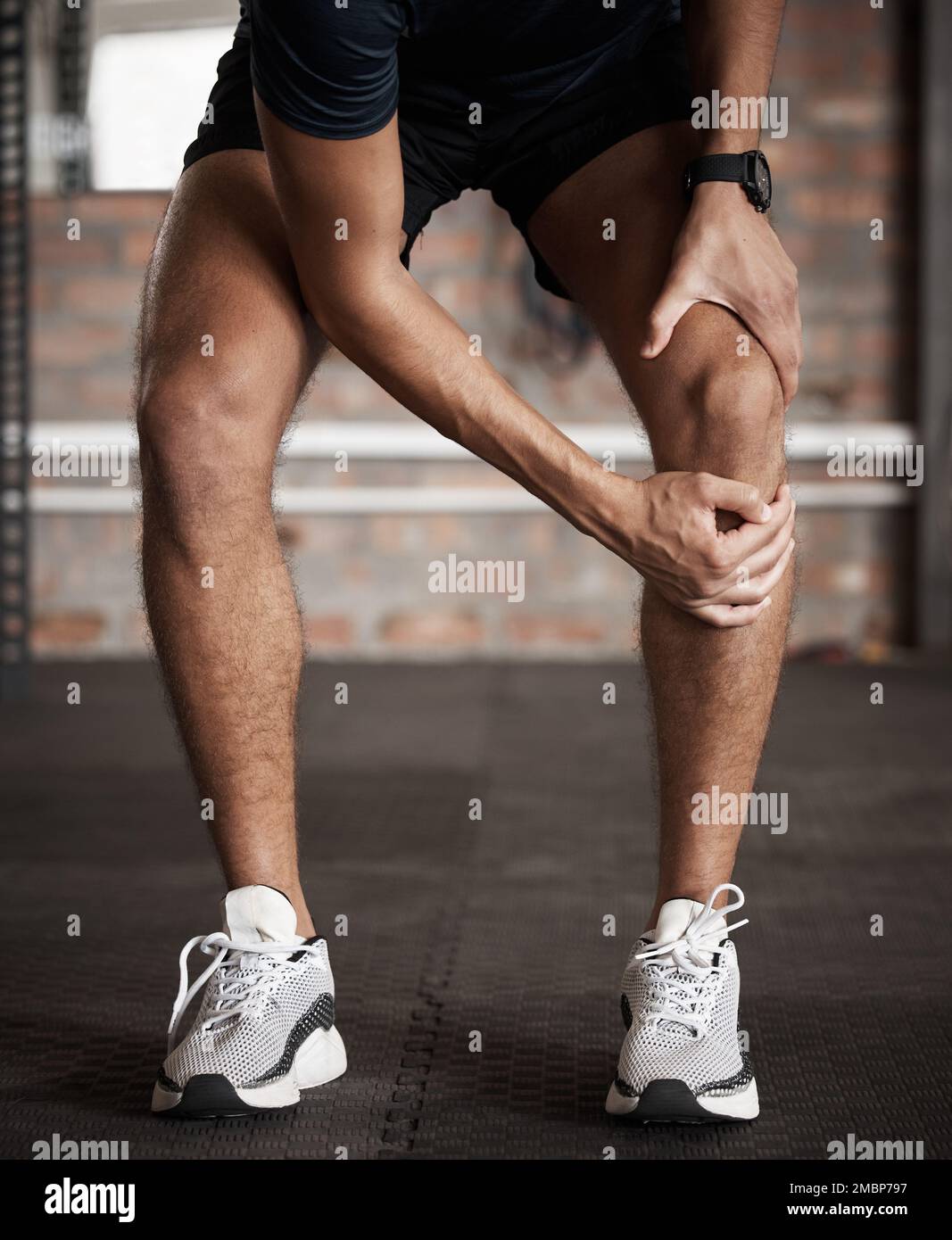 Knee injury, pain and fitness with a sports man holding his joint