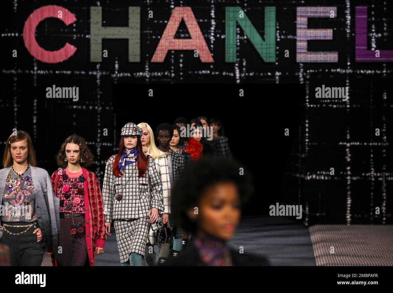 FILE - Models wear creations as part of the Chanel Ready To Wear  Fall/Winter 2022-2023 fashion collection, unveiled during the Fashion Week  in Paris on March 8, 2022. Multibillion dollar French high