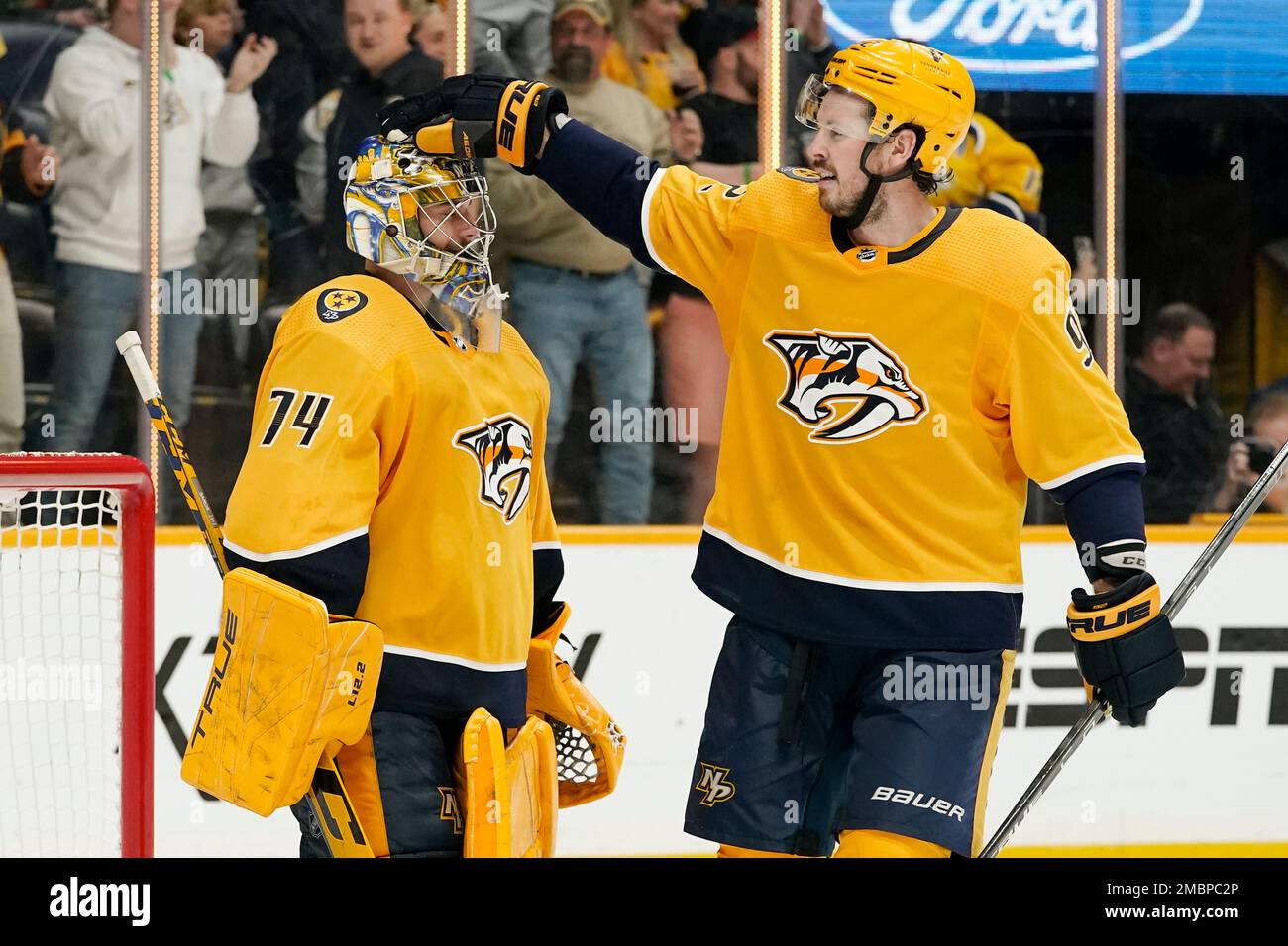 Nashville Predators goaltender Juuse Saros (74) puts his helmet on during  the third period of an NHL hockey game against the Tampa Bay Lightning  Tuesday, April 13, 2021, in Nashville, Tenn. (AP