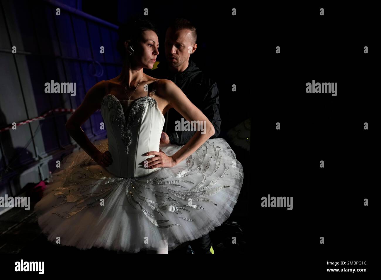 Anastasia Matvienko, and her husband Denis Matvienko, both from Ukraine,  warm up before a rehearsal at the Naples' San Carlo theater, Monday, April  4, 2022 . Ukrainian and Russian dancers took part