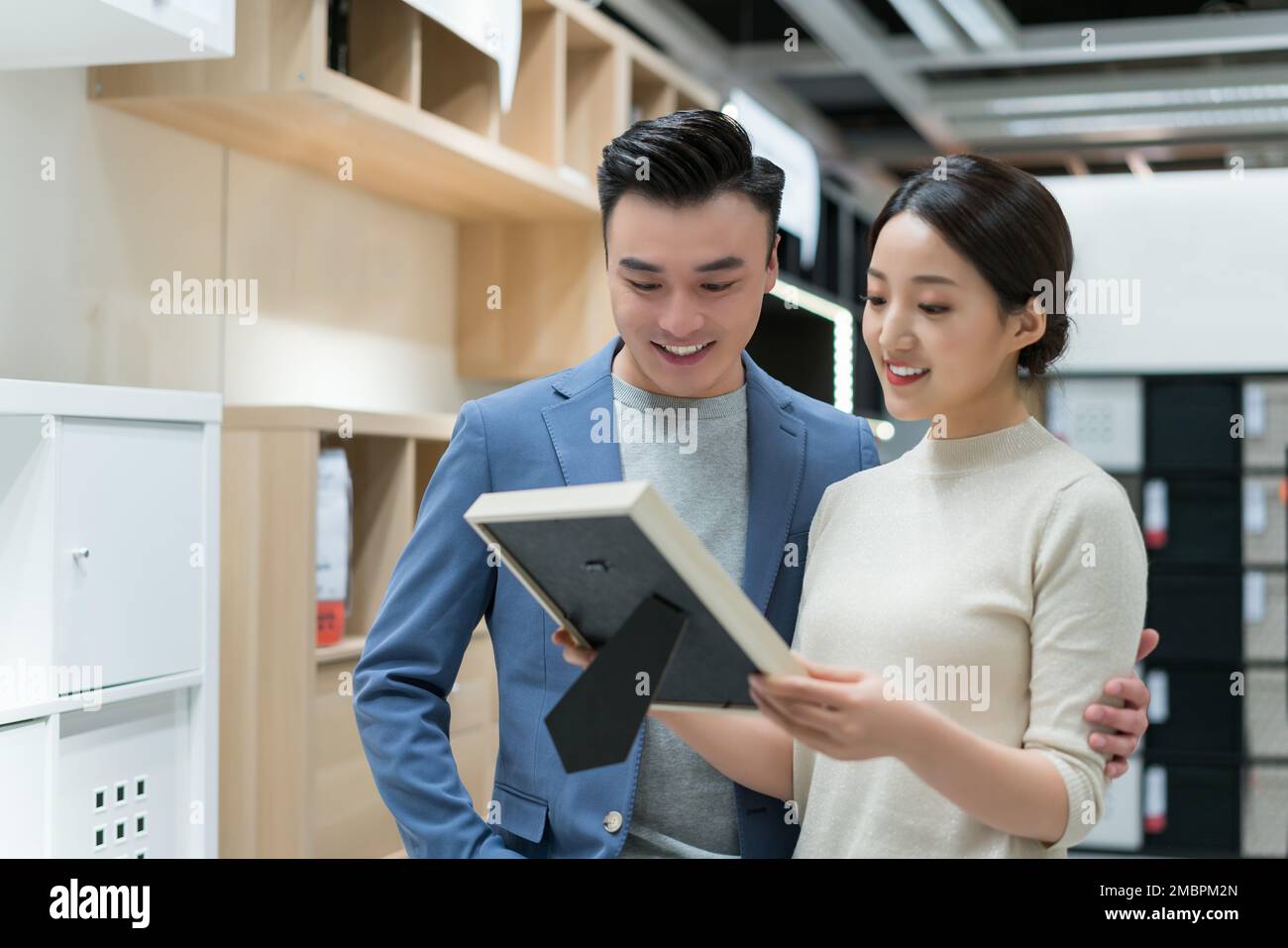 A young couple of choose and buy household items Stock Photo