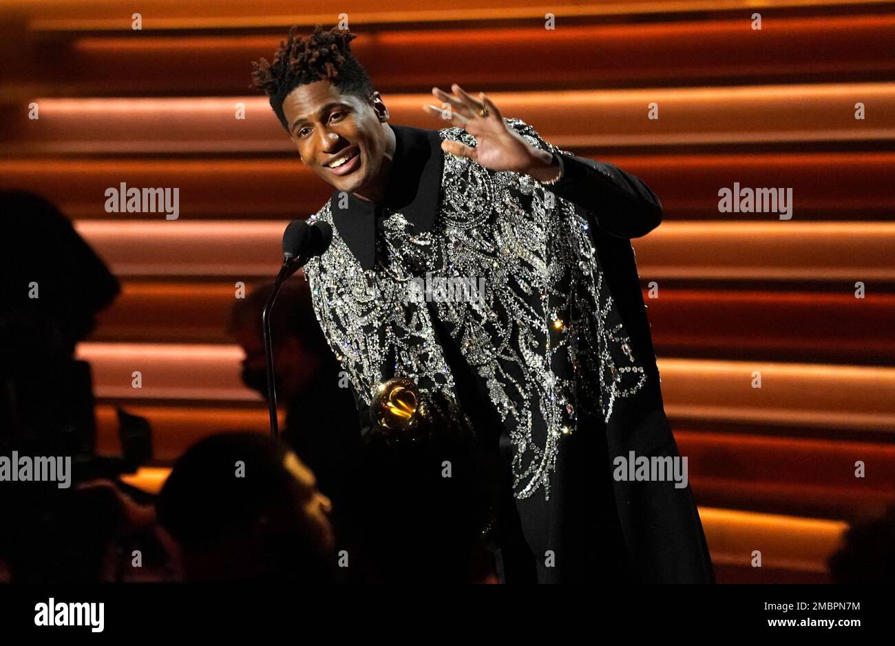 Jon Batiste accepts the award for album of the year for "We Are" at the